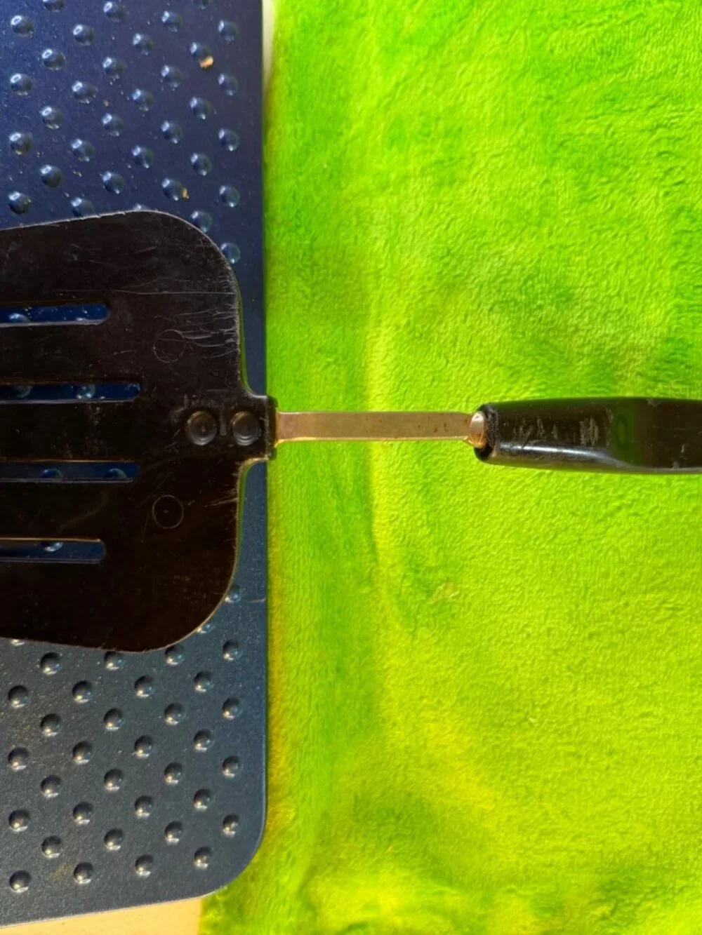 Vintage Black Slotted Metal Spatula with Plastic Handle
